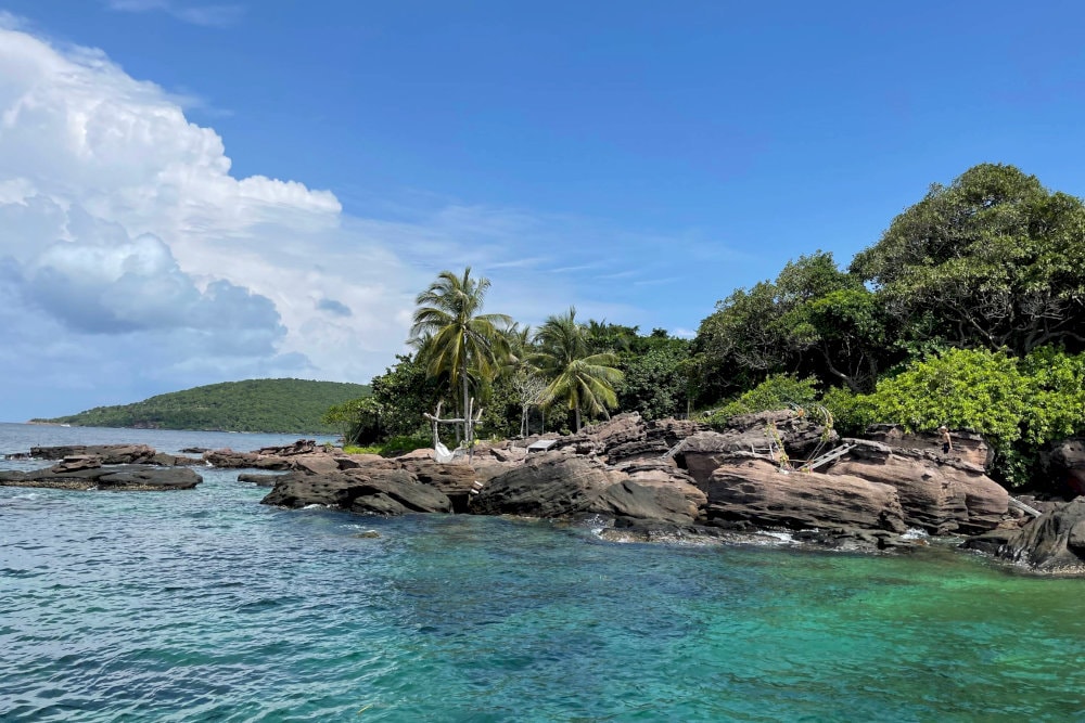 Gam Ghi Island is a vibrant snorkeling paradise, famous for its dense, colorful coral reefs and untouched natural charm